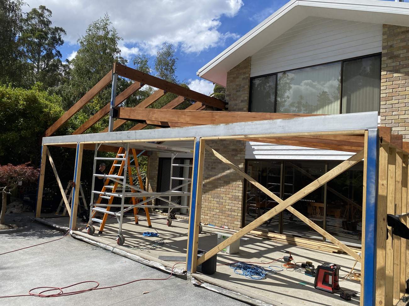 Full exterior structure with exposed hardwood rafters and beams
